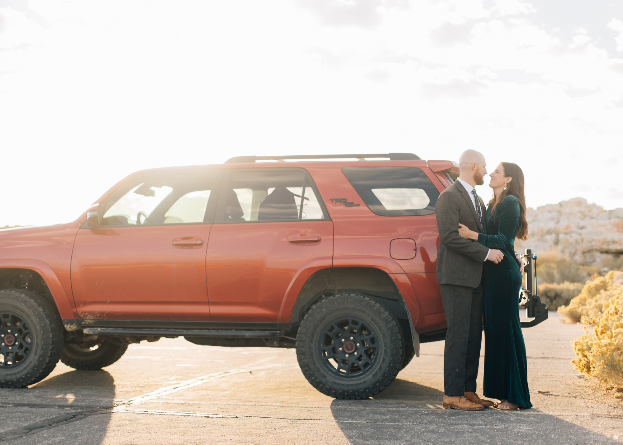 Adventure couple engagements with car
