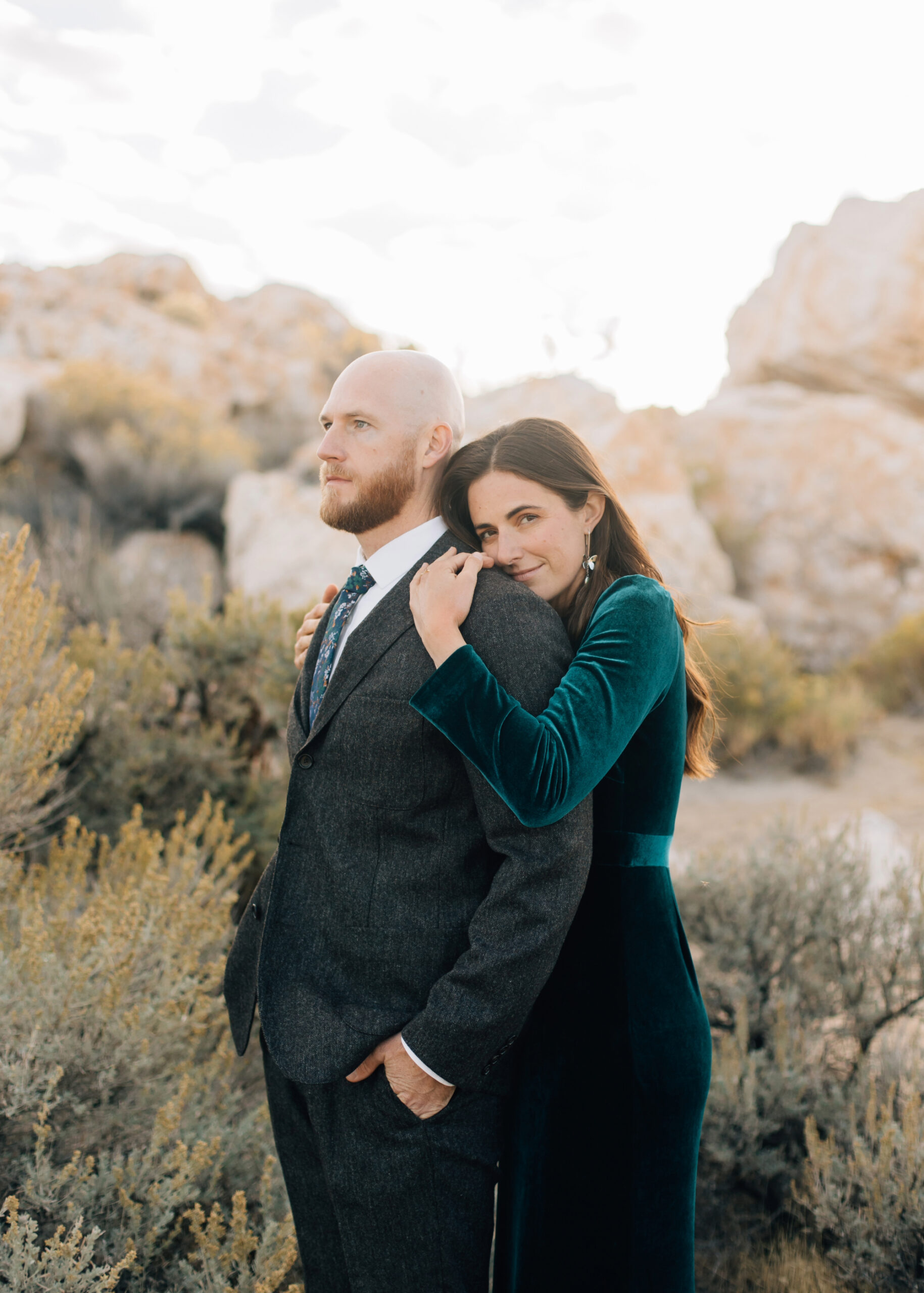 Sand and rocks beachy engagement photos