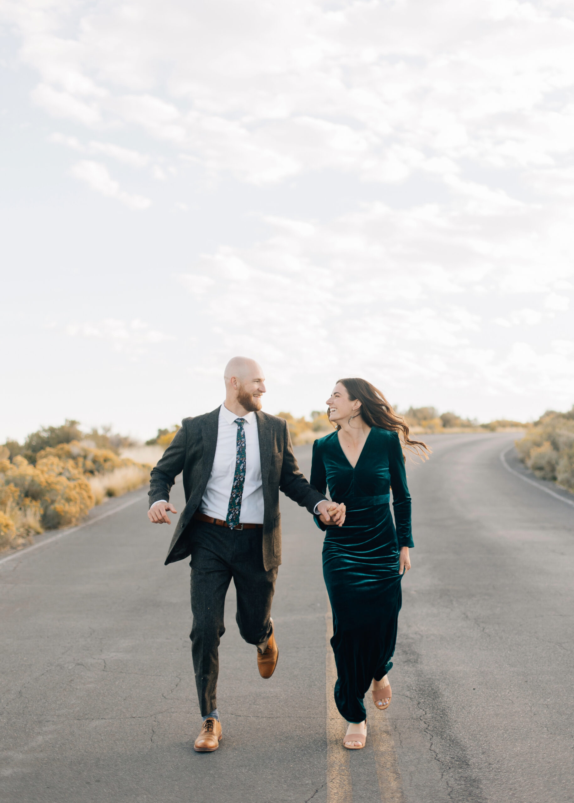 Formal engagements running down the road shot