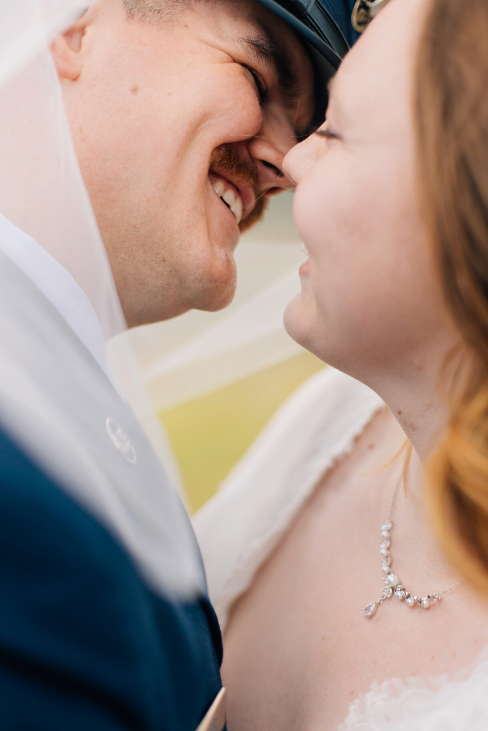 Wedding photos up close kissing shot