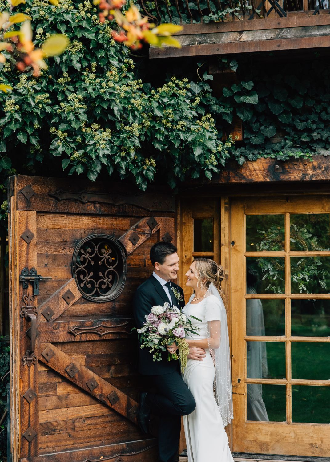 Wedding pose of couple smiling at each other
